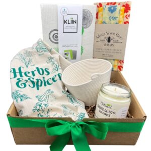 House warming gift box containing a Rope Basket Planter, Beeswax Food Wrap set, 3 reusable wipes, woodland candle, and herbs & spices tea towel.